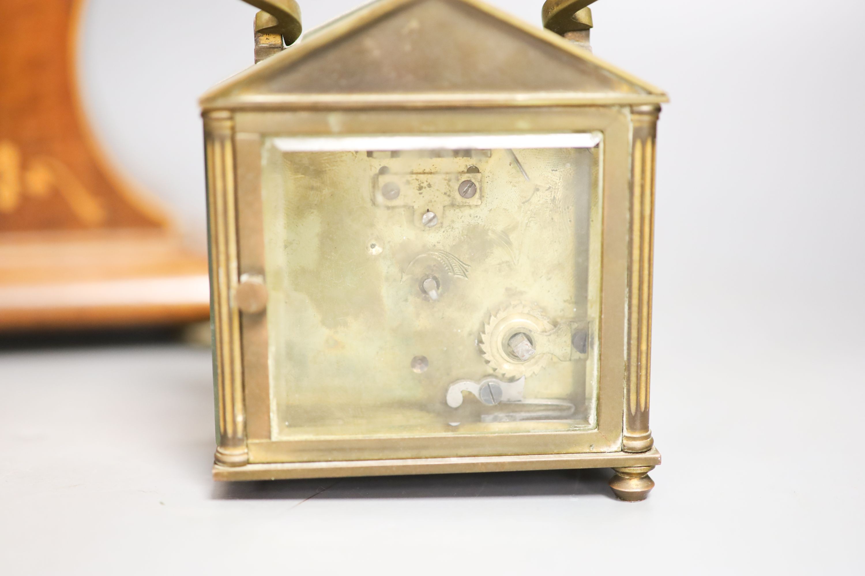 A Edwardian inlaid mahogany mantel timepiece and a brass carriage timepiece